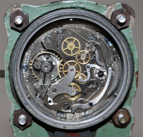 A Messerschmitt cockpit timepiece, numbered 30600, mounted on a piston head, 5.25in.